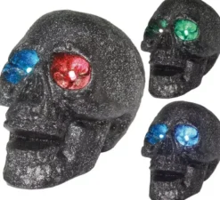 Teschio con luce negli occhi in colori assortiti 14 cm